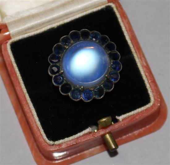 A white metal, moonstone and gem set dress ring, size M.